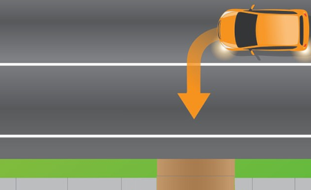 image of car making a left turn into a driveway