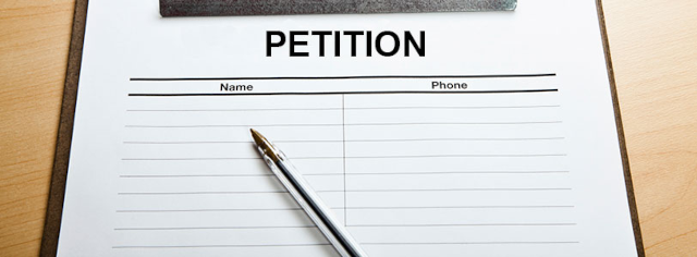 image of petition form and a pen on a clipboard