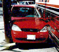 front view of car vs bus collision