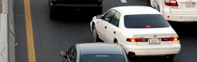 image of car changing lanes in traffic