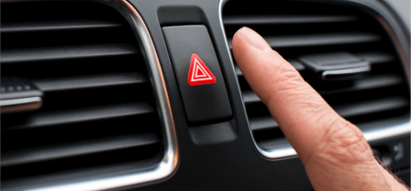 Image of finger and four way flashers button