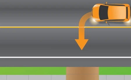 image of car making a left turn into a driveway