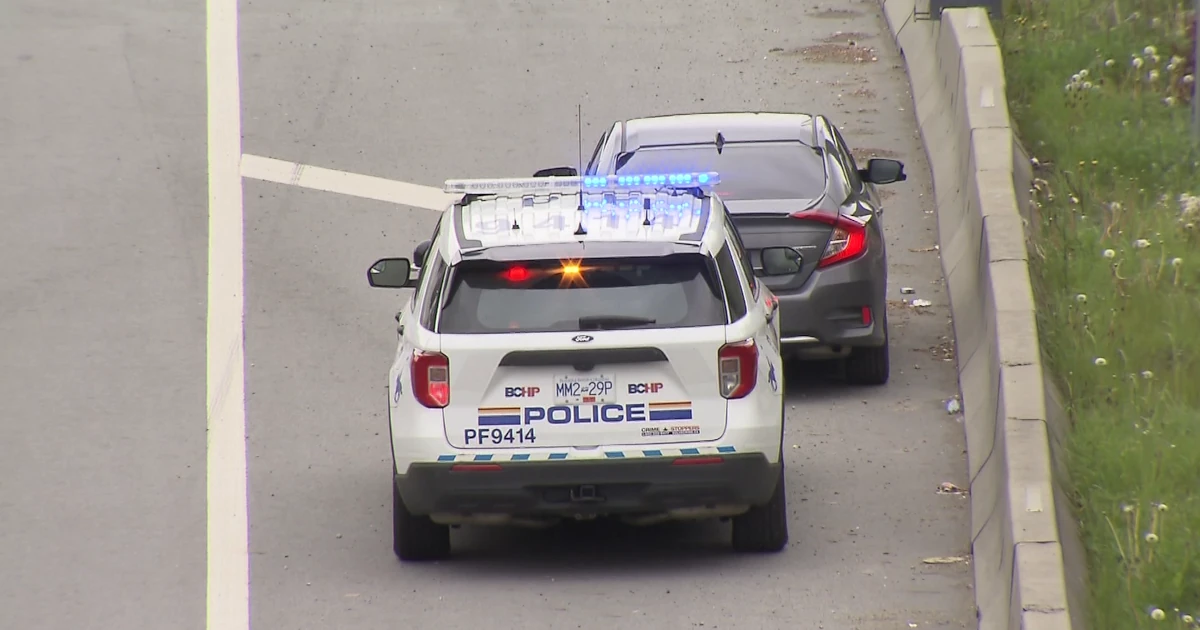 image of police cruiser with a car pulled over at the roadside