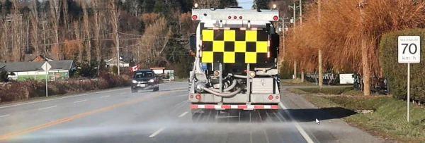 image of truck putting brine on the highway