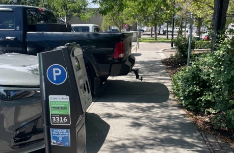 image of truck parking over the sidewalk