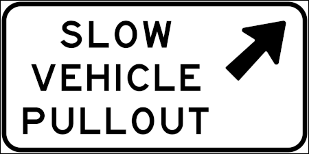 road sign announcing slow vehicle pullouts