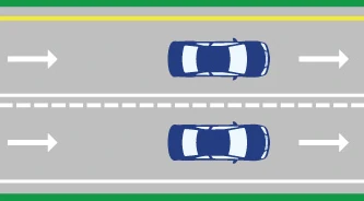 image of solid white line preventing left merge